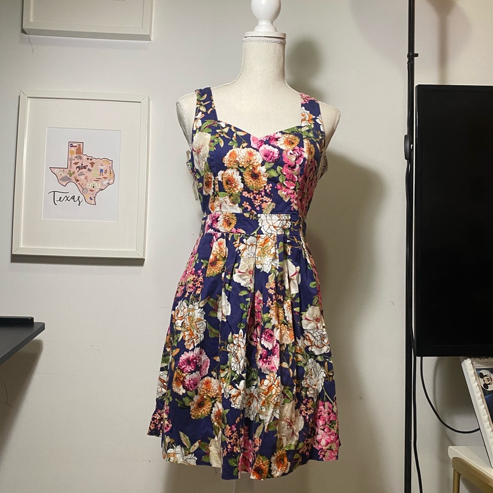 Have floral dress with backless heart-shaped design in size M